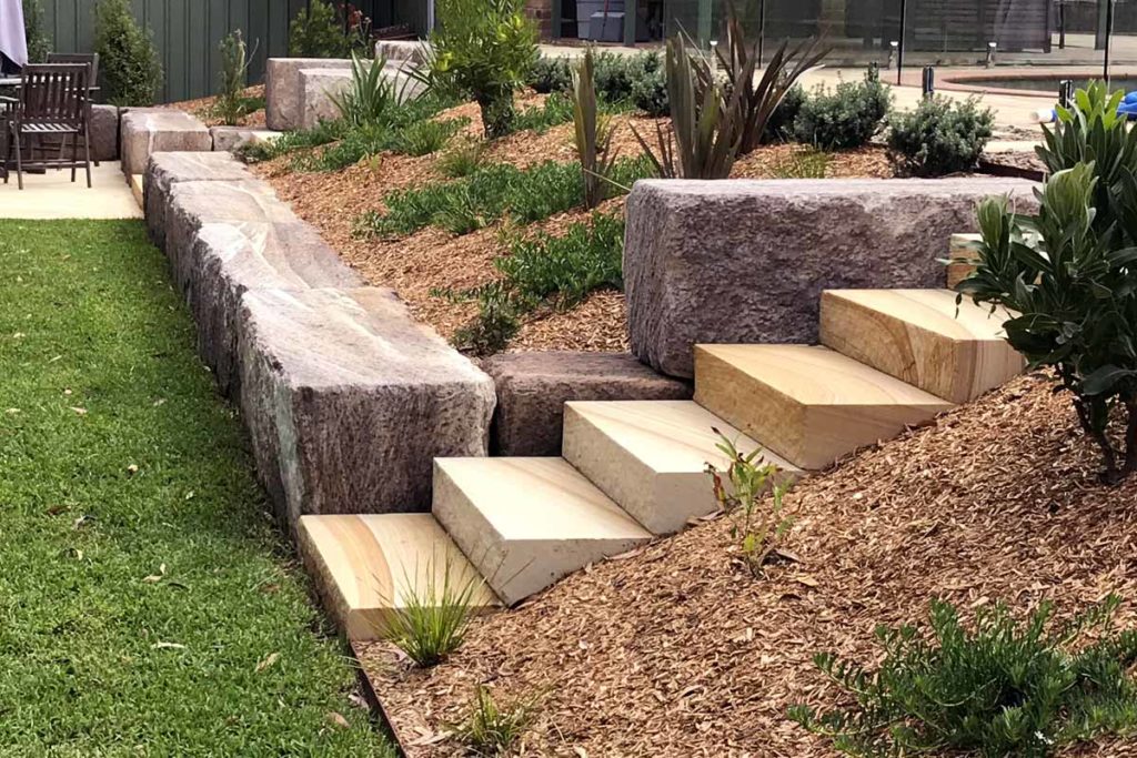 sandstone-log-retaining-walls-the-landscaped-garden